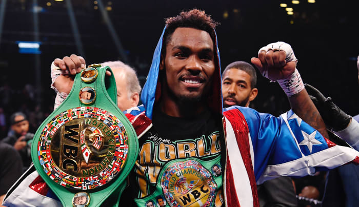 Jermall Charlo (blue and red trunks) reacts after knocking out Dennis Hogan of Ireland (white trunk) in the seventh round during a middleweight world championship fight at Barclays Center.